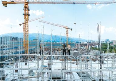 Civil construction project with steel framework and cranes