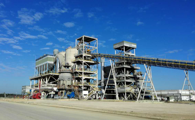 Mining, cement and concrete process plant under a blue sky